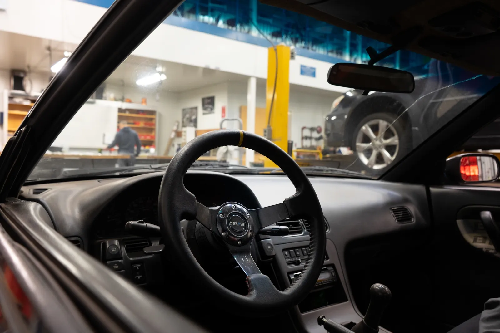 Driver’s view of a car interior at a gas station